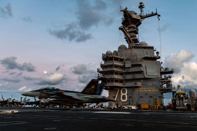 An F/A-18F Super Hornet aircraft lands on the flight deck of the USS Gerald R. Ford during Operation Epic Fury in the Mediterranean Sea, in this handout photo provided by the US Navy on March 2.