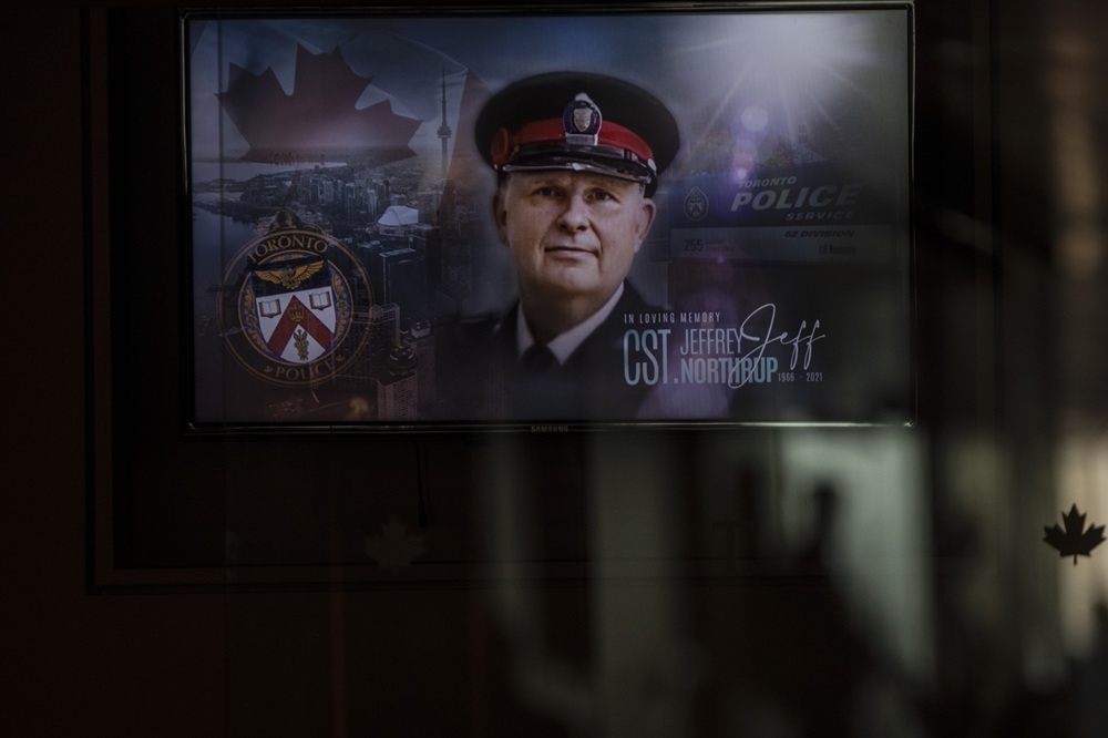  The face of Toronto Police officer Jeffrey Northrup is seen on a plasma screen at his his funeral service, in Toronto on July 12, 2021. CHRIS YOUNG/THE CANADIAN PRESS