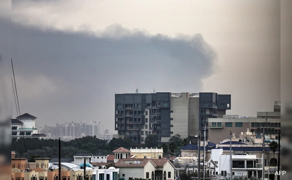 Debris fall over Dubai after air defences intercept missiles from Iran