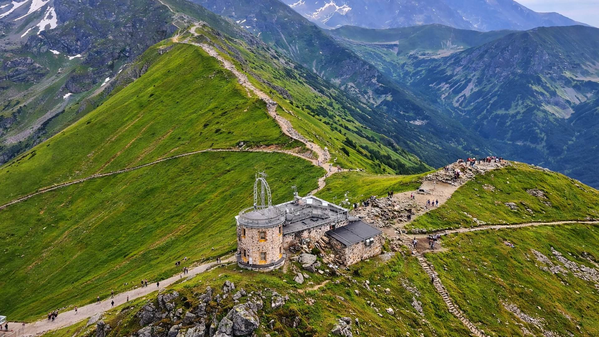 What makes hiking along a mountain ridge so unique?
