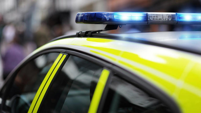 Two in hospital after crash involving police car
