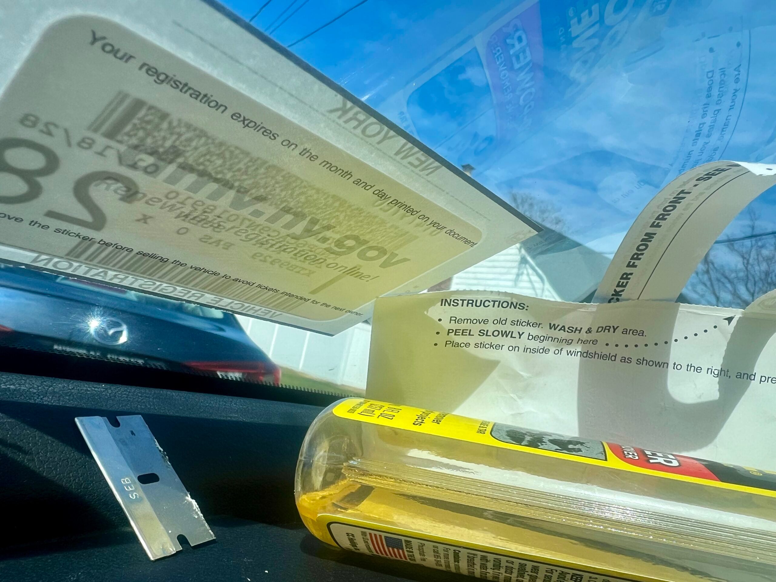 Why are New Yorkers still scraping at registration stickers in 2026?