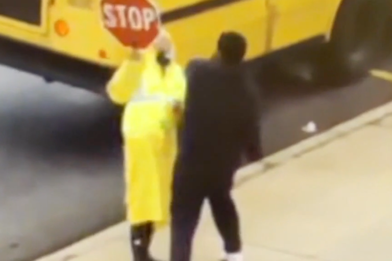 Impatient driver leaps out of car and punches female crossing guard