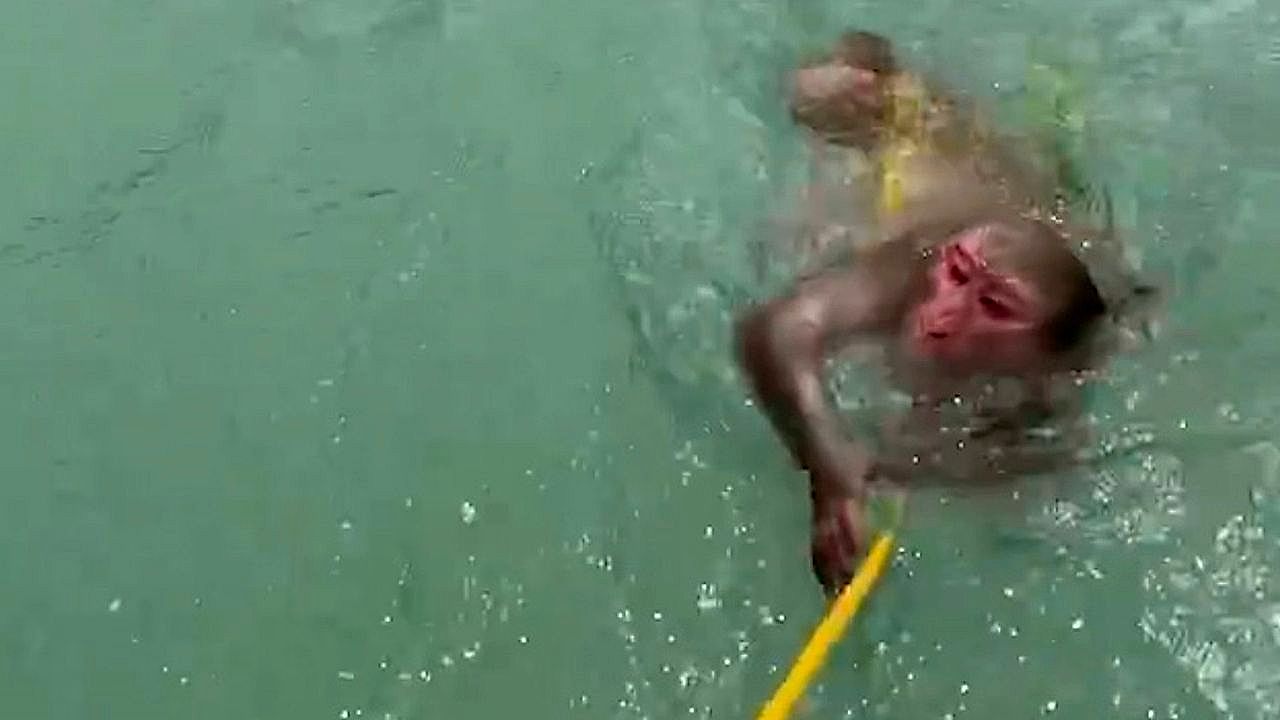 Rafters spring into action after spotting monkey in distress mid-river