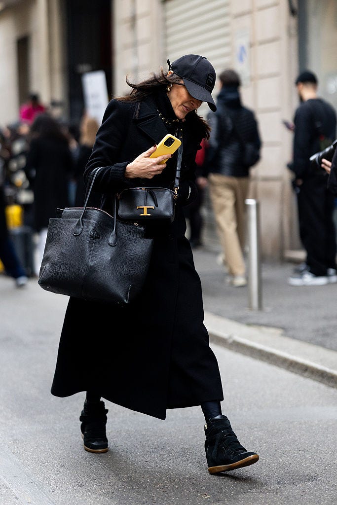 guest-wears-a-black-baseball-hat-a-black-leather-tods-news-photo-1773759259.jpeg