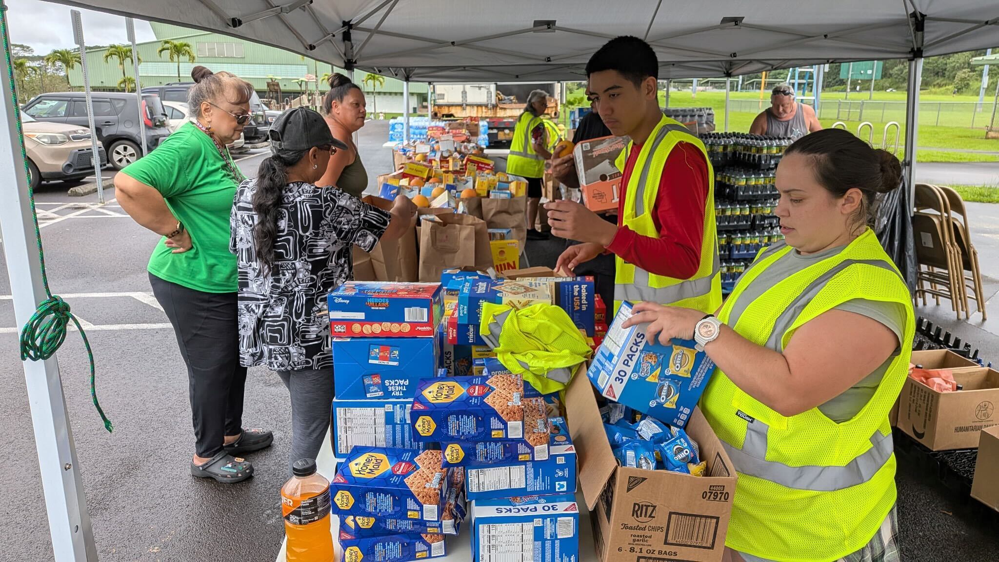 Out of the park: Nonprofit distribution drive draws long lines after ...