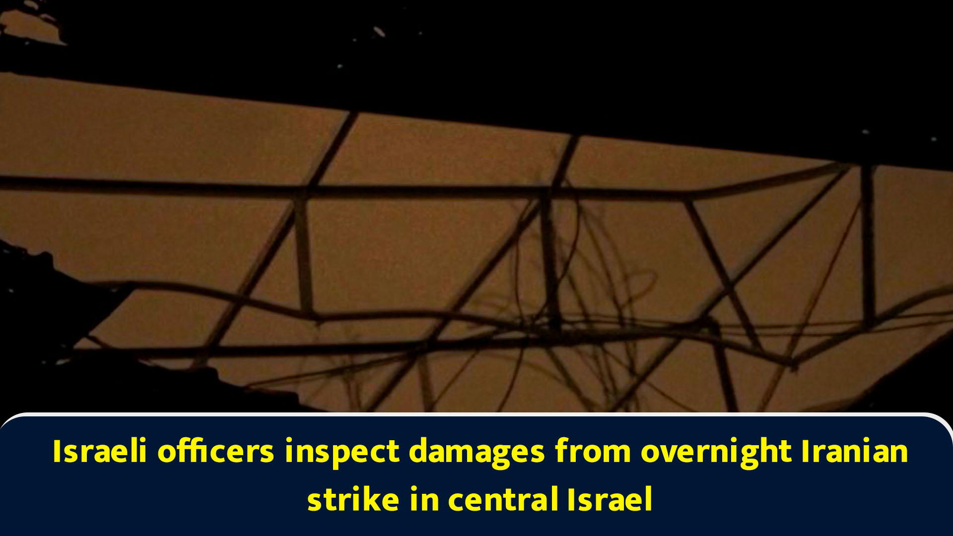 Israeli officers inspect damages from overnight Iranian strike in ...
