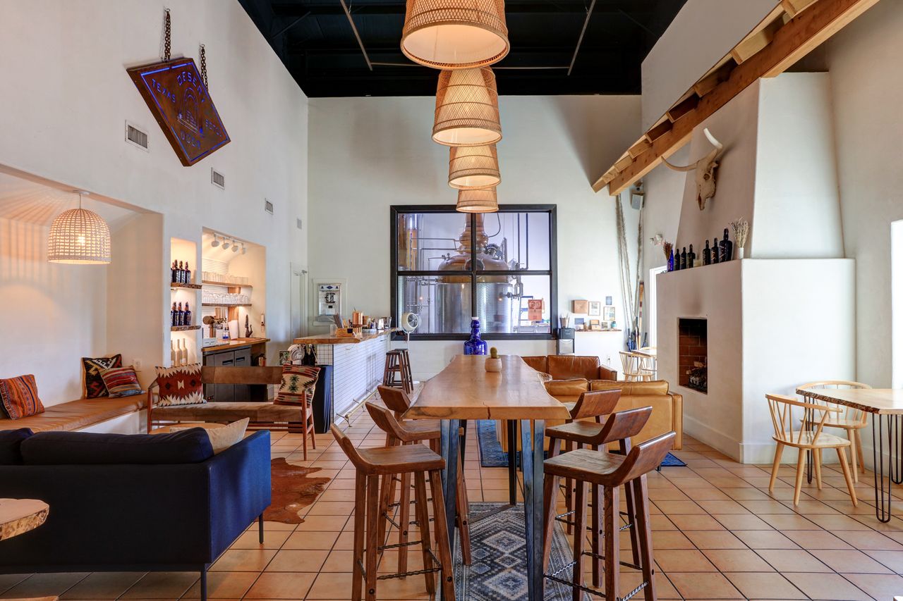Interior view of a tasting room with seating areas tables and decor