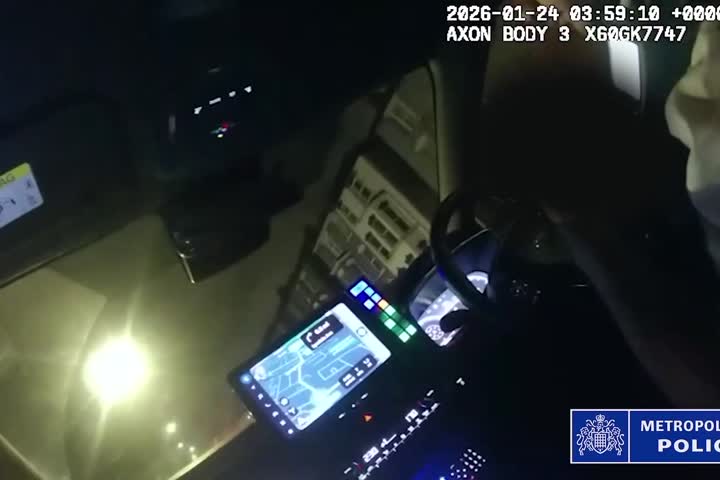 Terrifying moment 'stolen' Land Rover reverses over police car