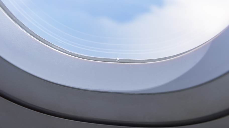 Why do airplane windows have tiny holes?