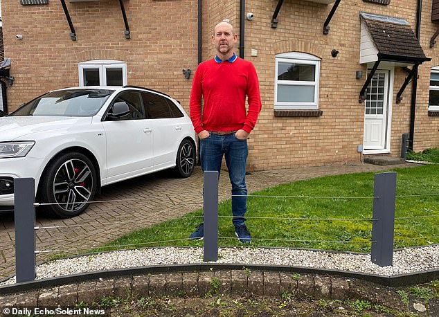 Homeowner ordered to tear down 'illegal' 2ft fence after being reported to council by his neighbour