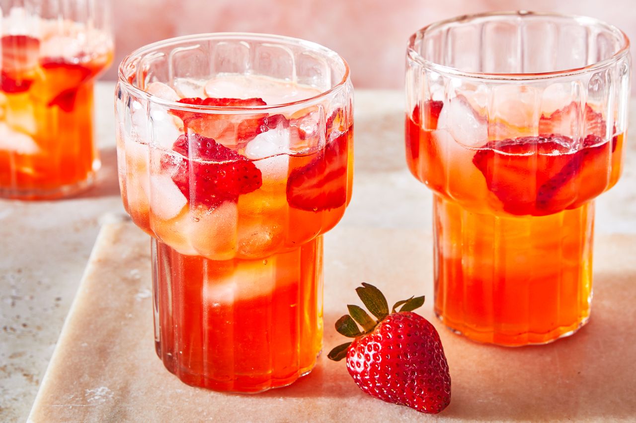 Southern Living Strawberry Lemonade in a glass to serve with ice and strawberry slices