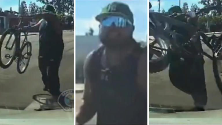 Man throws bicycle at a car in the middle of traffic in Santa Ana