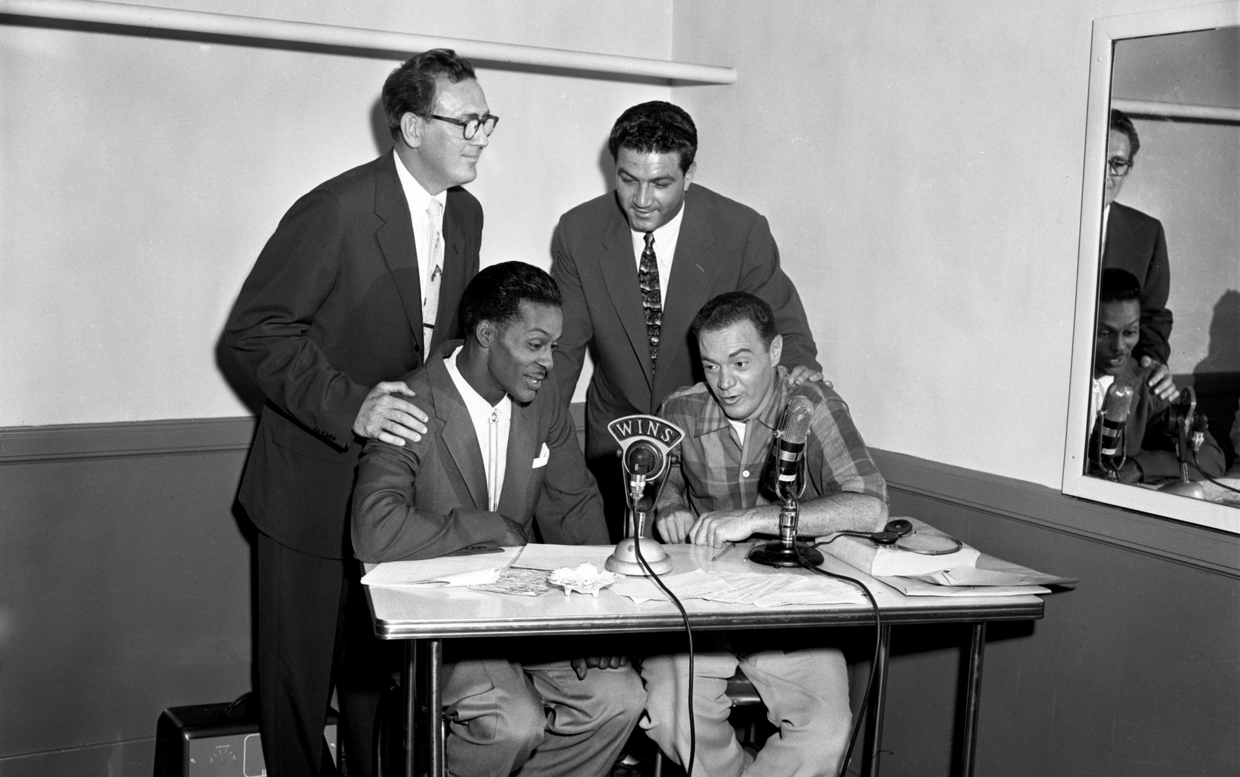 Chuck Berry and Alan Freed on the microphone: The DJ got in hot water over his songwriting credits on Berry's song Maybellene
