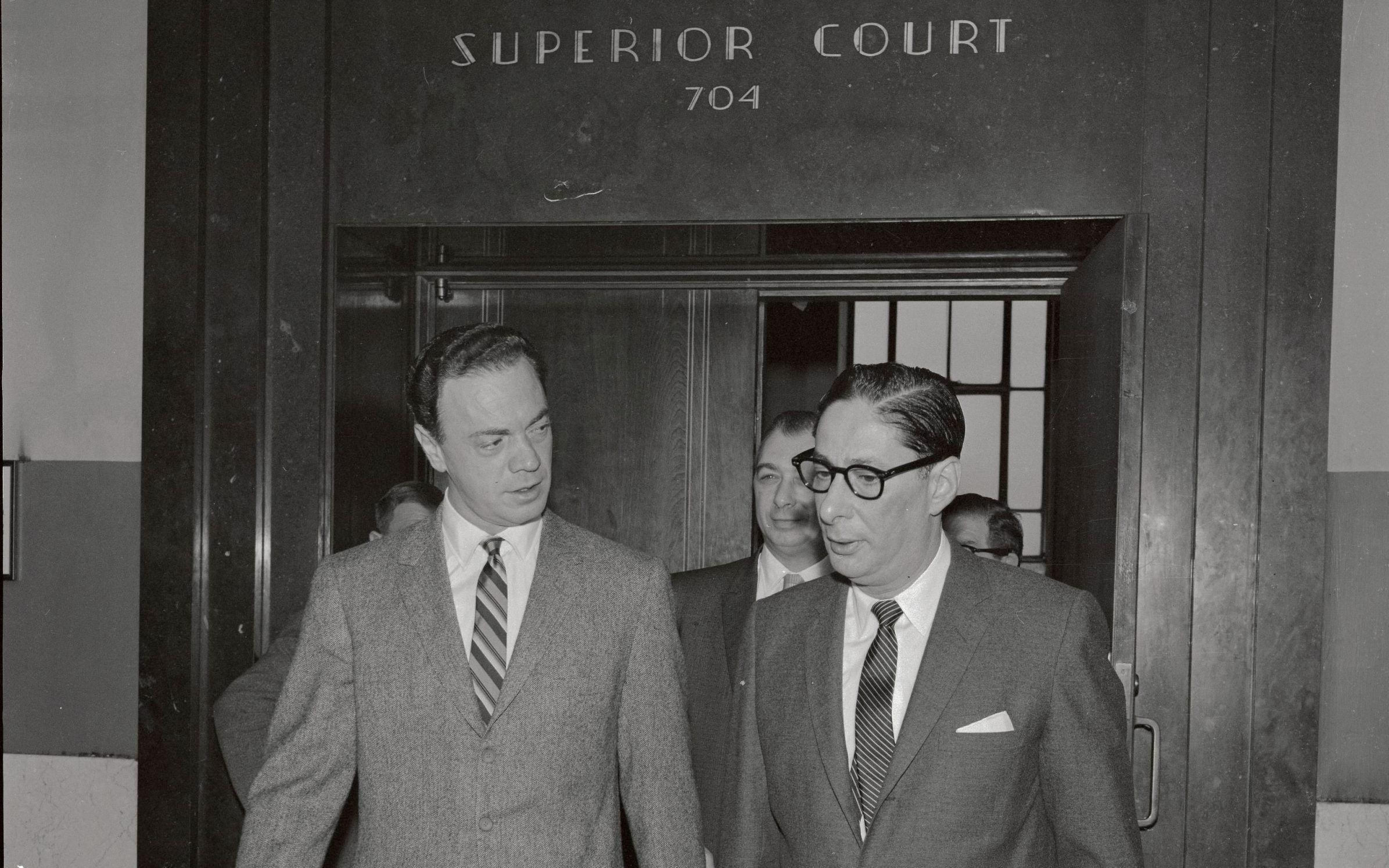 Alan Freed (left) with his solicitor in New York Superior Court, 1962