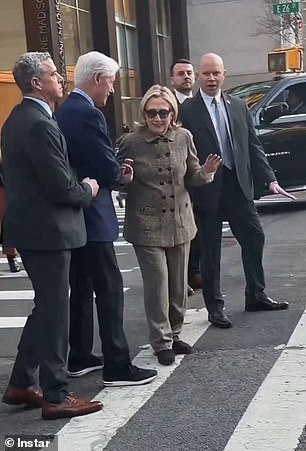 Awkward moment Hillary Clinton scolds husband Bill when he nudges her ...