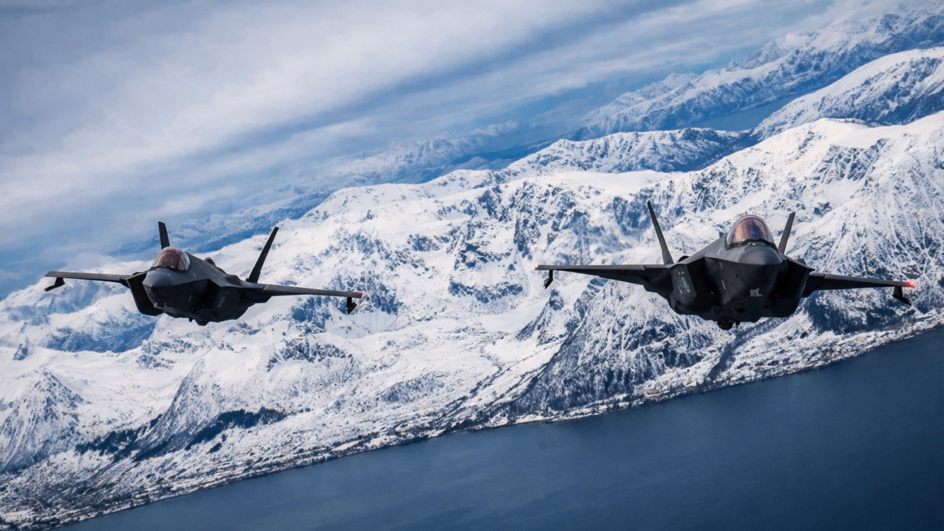 NATO aircraft fly in formation above ships in Arctic