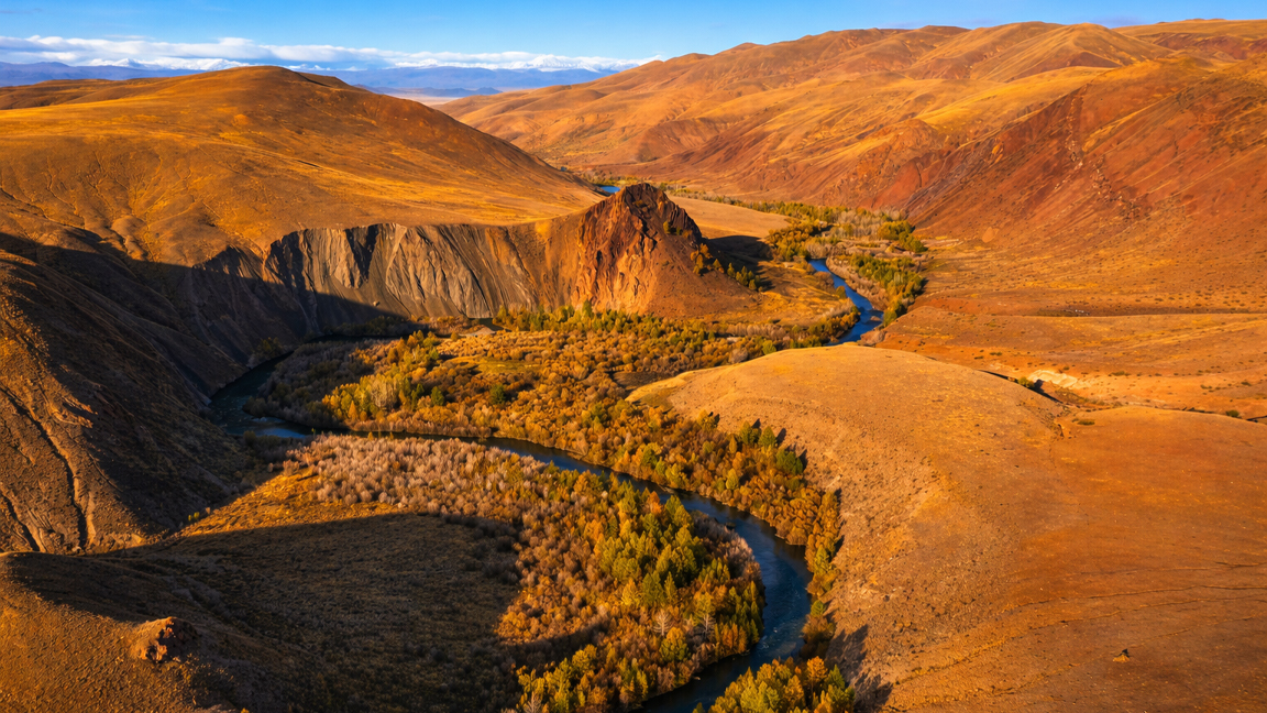 A hidden river flowing through endless hills