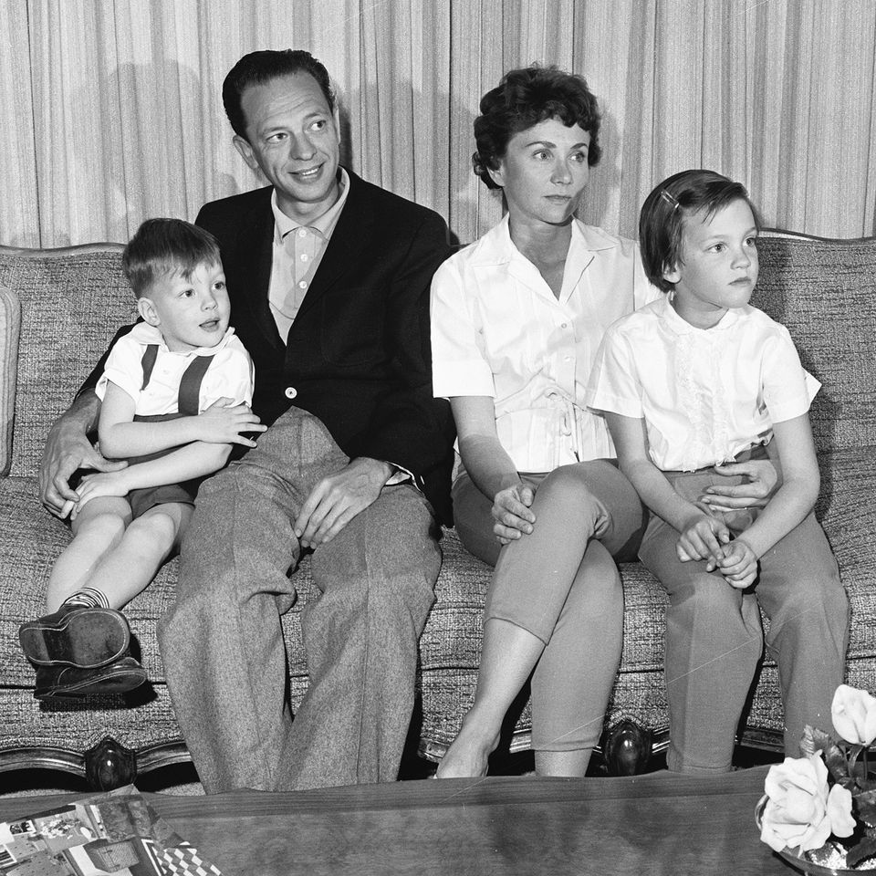 American television actor Don Knotts (second left) sits on a couch with his family at home, March 2, 1961. From left, son Tom, Knotts, wife Kay, and daughter Karen Credit: CBS Photo Archive/Getty