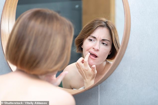 Dr Mark Burhenne, known online as The Sleep Dentist , warns that common dental problems could indicate an imbalance in the oral microbiome - the 'good' bacteria in your mouth (stock)