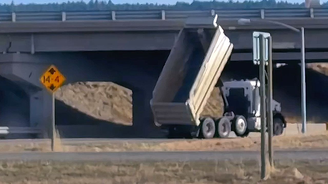 Dump truck smashes into underpass in Montana