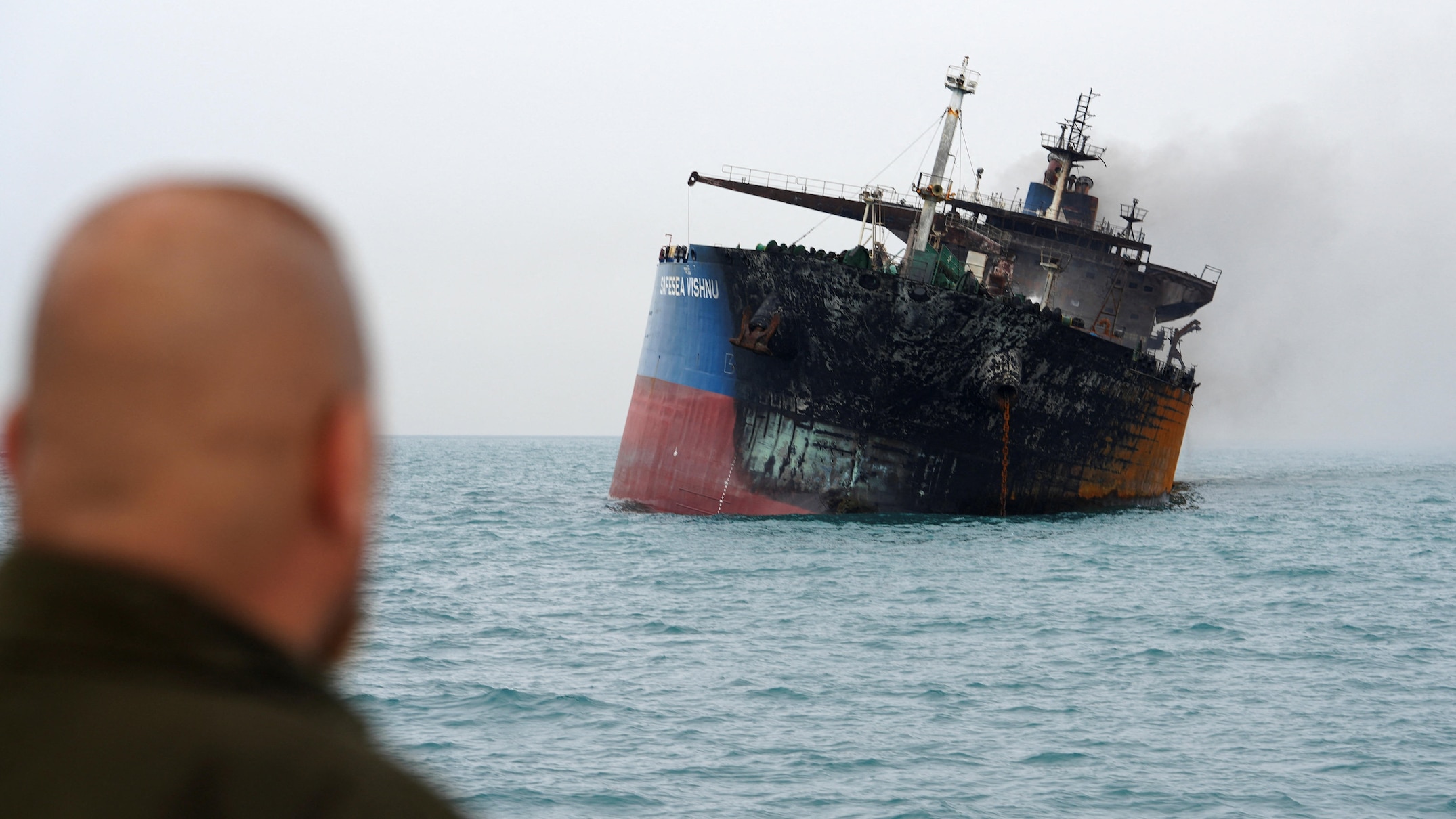 Oil tankers burn as Iran's new leader vows to keep Strait of Hormuz closed