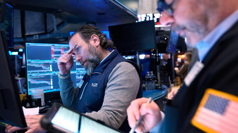 Dow closes down 700 points as global oil prices top $100 a barrel