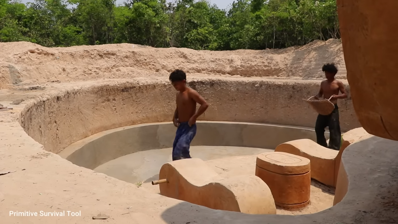 Watch these primitive men build a hidden underground house with a pool