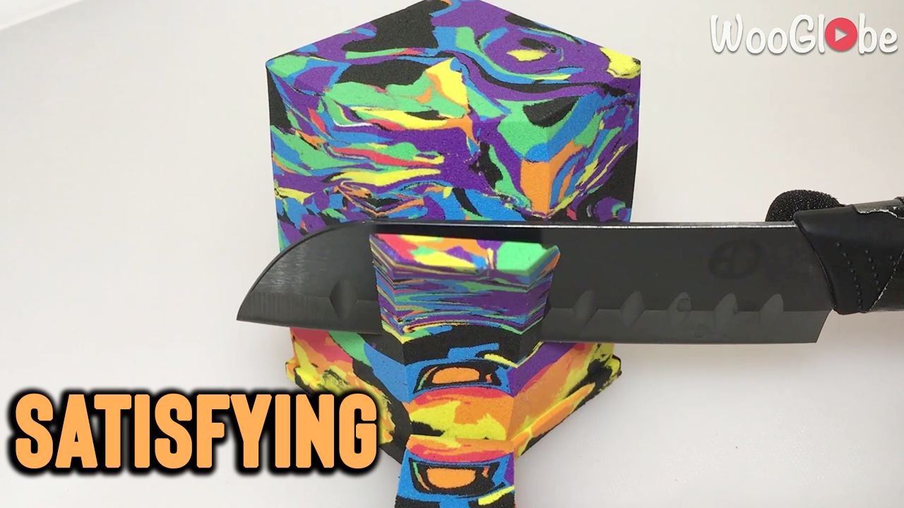 Satisfying ASMR clip of soft, multicolored sand block getting smoothly ...