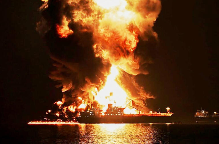 Dow closes down 700 points as global oil prices top $100 a barrel