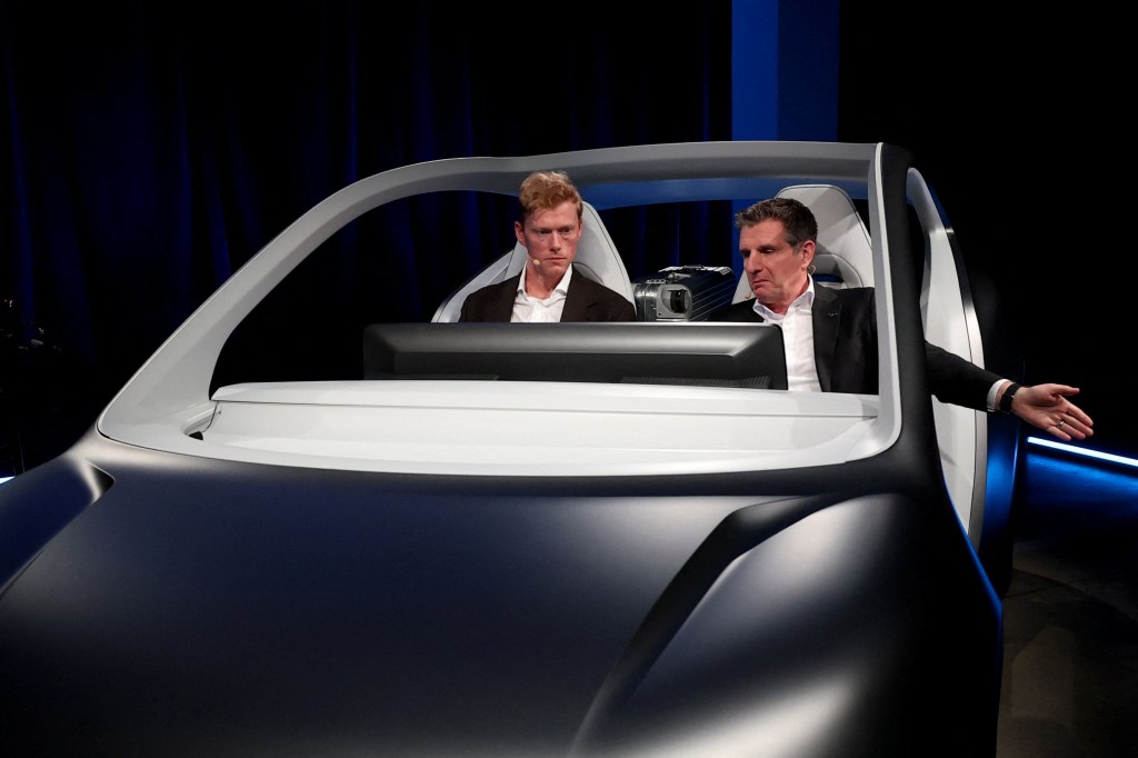 Tesla rival Lucid unveils two-seat robotaxi without a steering wheel or ...