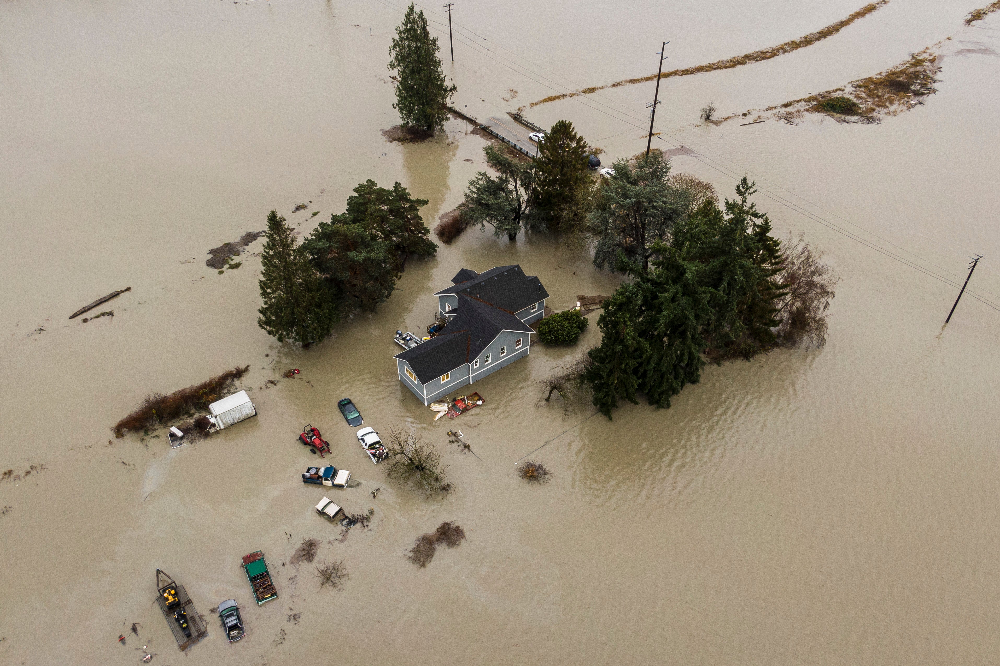 At least 1 dead, more than 87,000 without power as atmospheric river ...