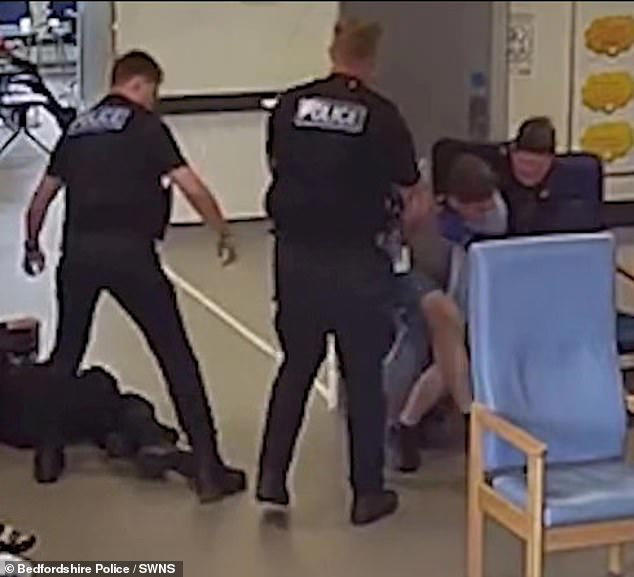 Moment thug headbutts police officer and knocks them both unconscious ...