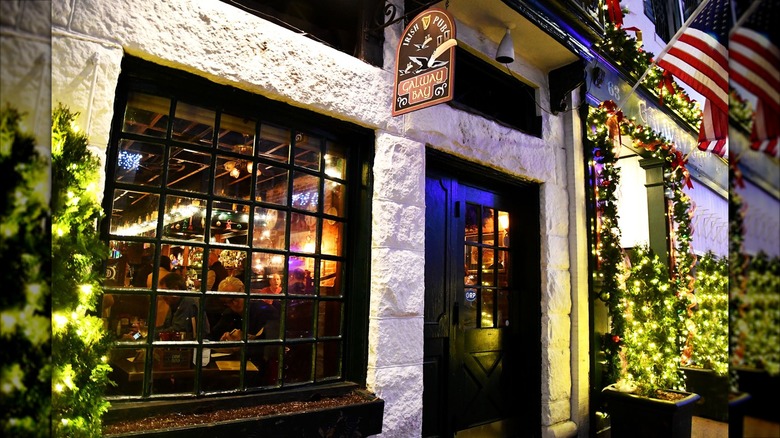 Exterior of Galway Bay white building with black trim and Christmas decorations