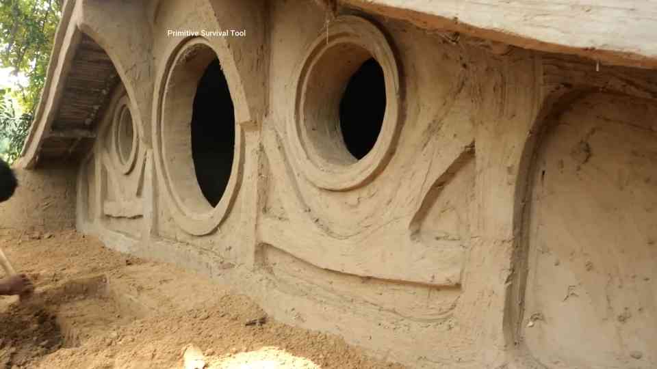 Watch these primitive men create a hidden hobbit house in the jungle