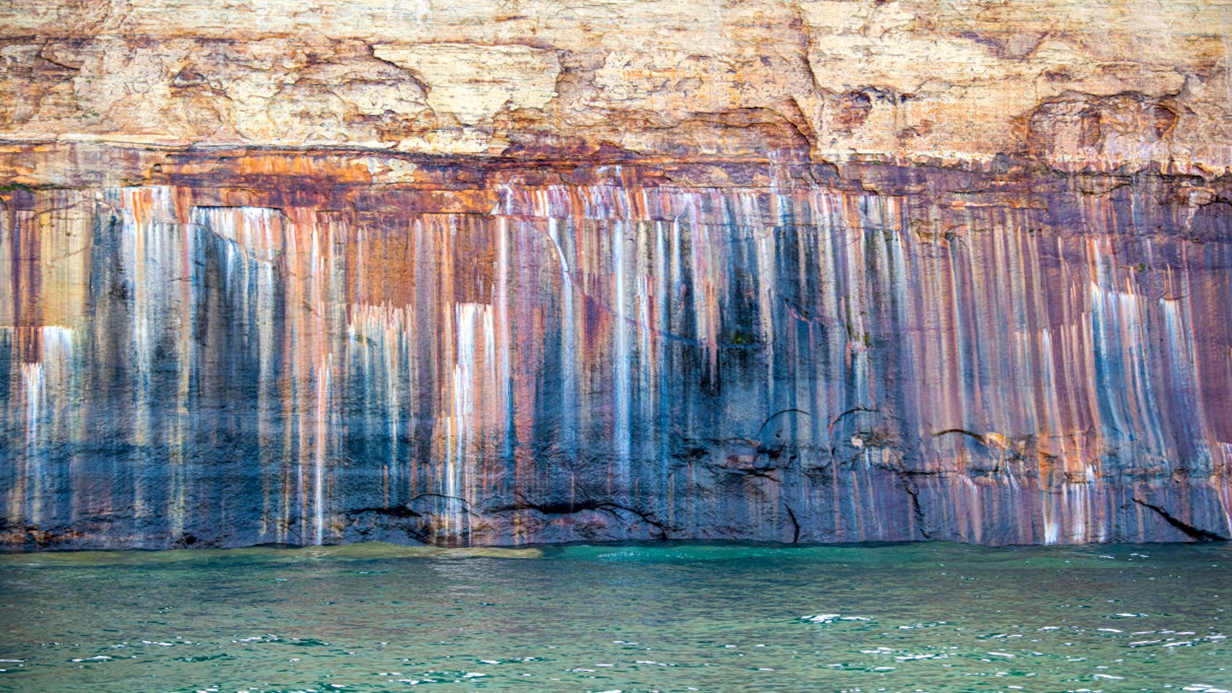 Officials say four people stole rocks and defaced cliffs at a National ...
