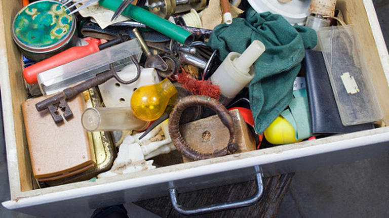 Keep your junk drawer looking neat with a clever tip from Martha Stewart