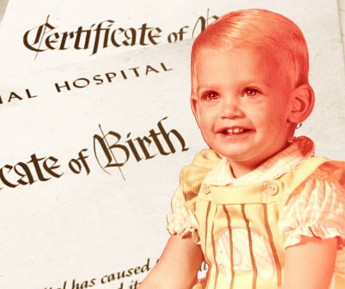 Child smiling in front of a birth certificate document background