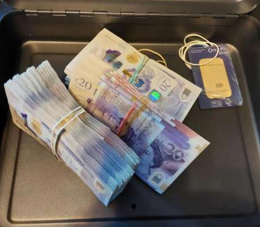 Kent Police recovered cash and a gold bar in a raid (Kent Police/PA Wire)