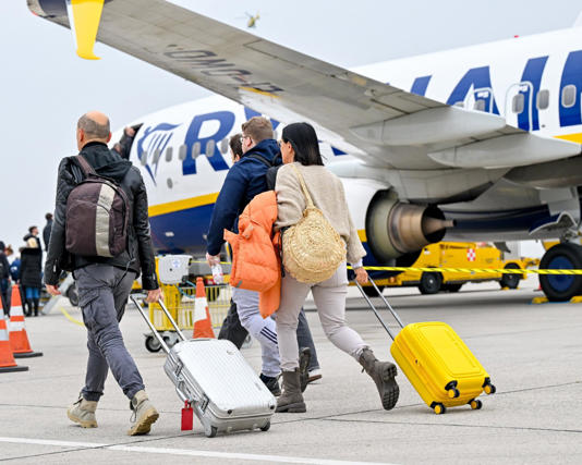 Passengers board a Ryanair flight at Linz airport in November 2024. A Ryanair plane was boarded by a bailiff as it sat on the asphalt at the airport on Monday. Photograph: APA-PictureDesk GmbH/REX/Shutterstock