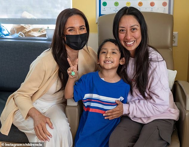 Meghan Markle masks up to surprise children in hospital as she agrees deal  on latest documentary