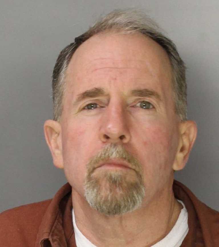 Man points gun at officers who knocked on door, police say