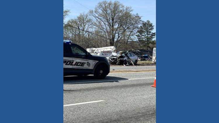 Road closed after car crashes into power pole in Greensboro