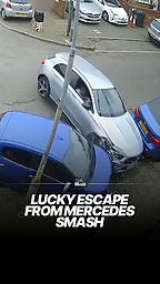 Pedestrians' lucky escape as car smashes into parked vehicle