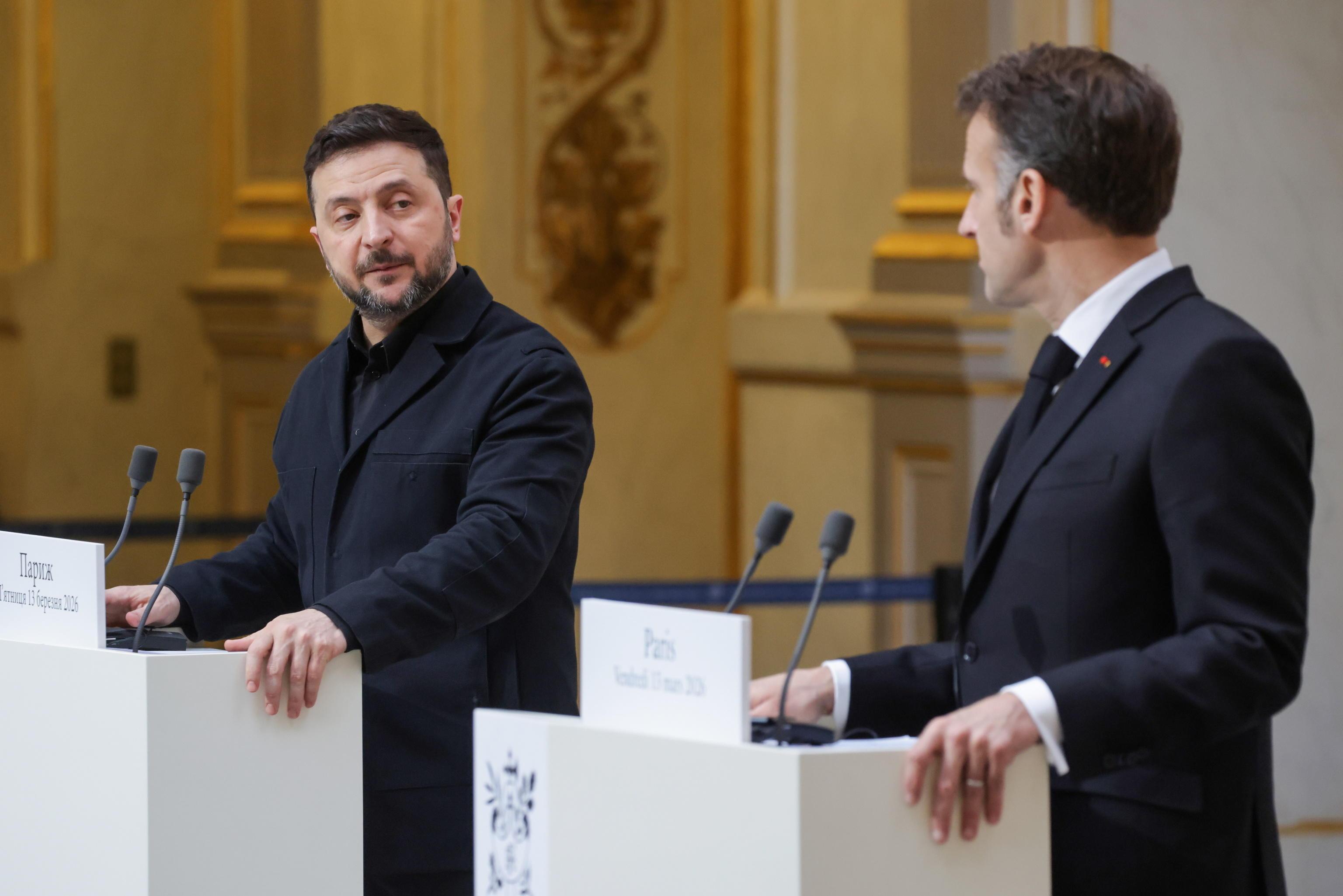 epa12816968 French President Emmanuel Macron (R) and Ukrainian President Volodymyr Zelensky (L) hold a press conference following their talks at the Elysee Palace in Paris, France, 13 March 2026. Zelensky and Macron discussed ongoing support for Ukraine from France and European partners, as well as progress on the 'Coalition of the Willing', a framework for long-term security guarantees. EPA/LUDOVIC MARIN / POOL MAXPPP OUT