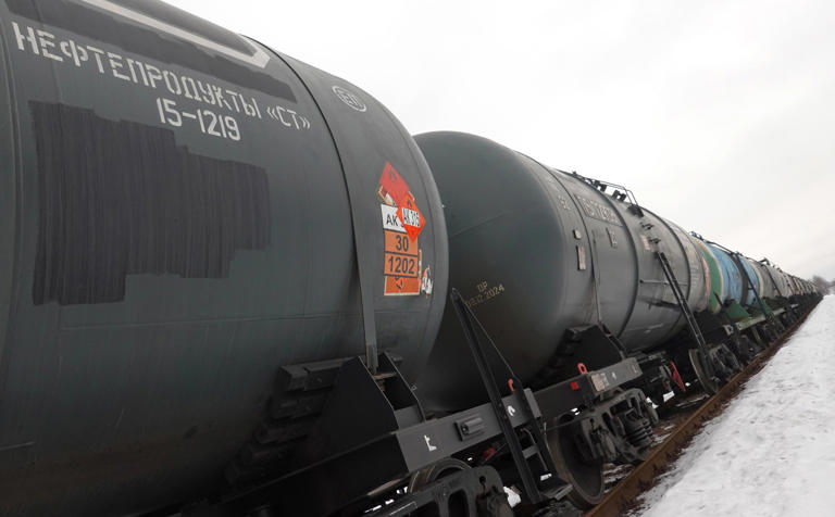 epa10450774 Railway tankers carrying oil products with text 'Oil products' stand outside Moscow, Russia, 06 February 2023. On 24 February 2022 Russian troops entered Ukrainian territory in what the Russian president declared a 'Special Military Operation', resulting in multiple sanctions against Russia, including sanctions against the oil industry. EPA/MAXIM SHIPENKOV