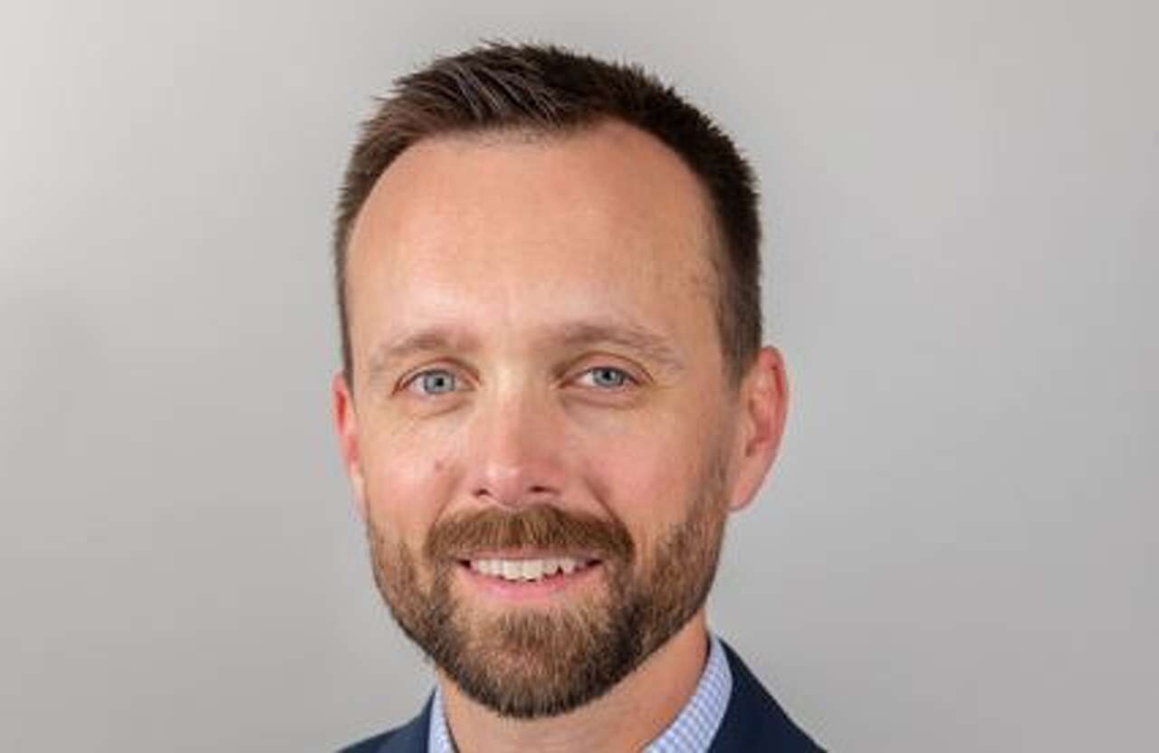 Madison County Board Chairman Chris Slusser gets served papers at board ...