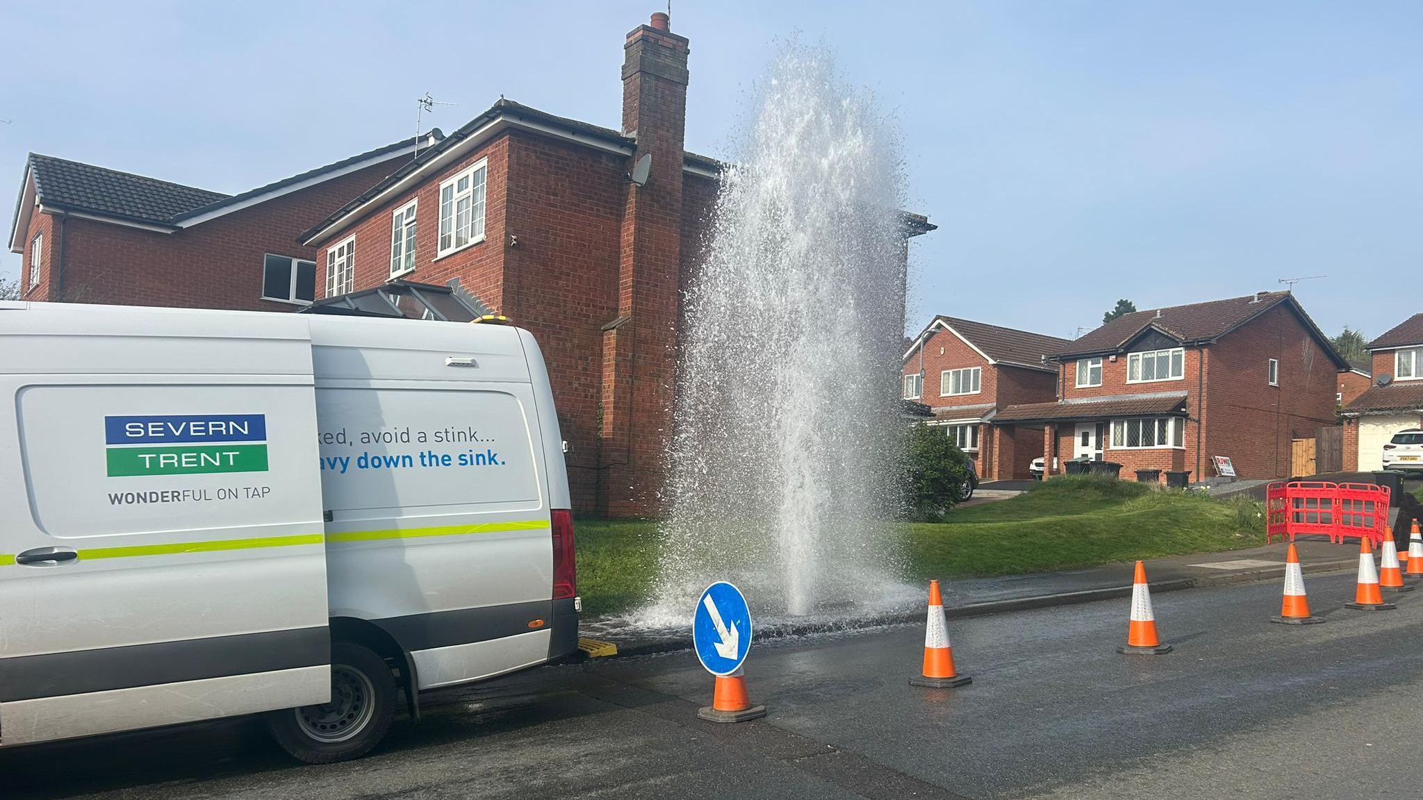 Water erupts from street, disrupting homes