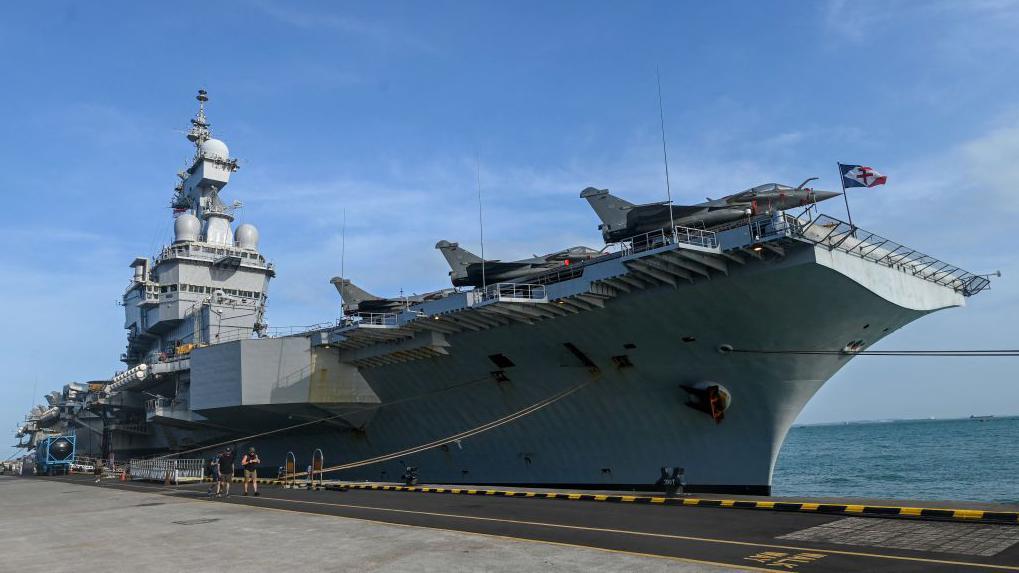 Officer reportedly leaks location of French aircraft carrier with ...