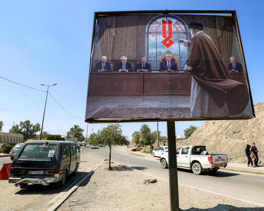 A billboard in Baghdad, Iraq, depicts Iran’s former supreme leader, Ali Khamenei, confronting former Joe Biden, Boris Johnson, Emmanuel Macron, Donald Trump and Benjamin Netanyahu.